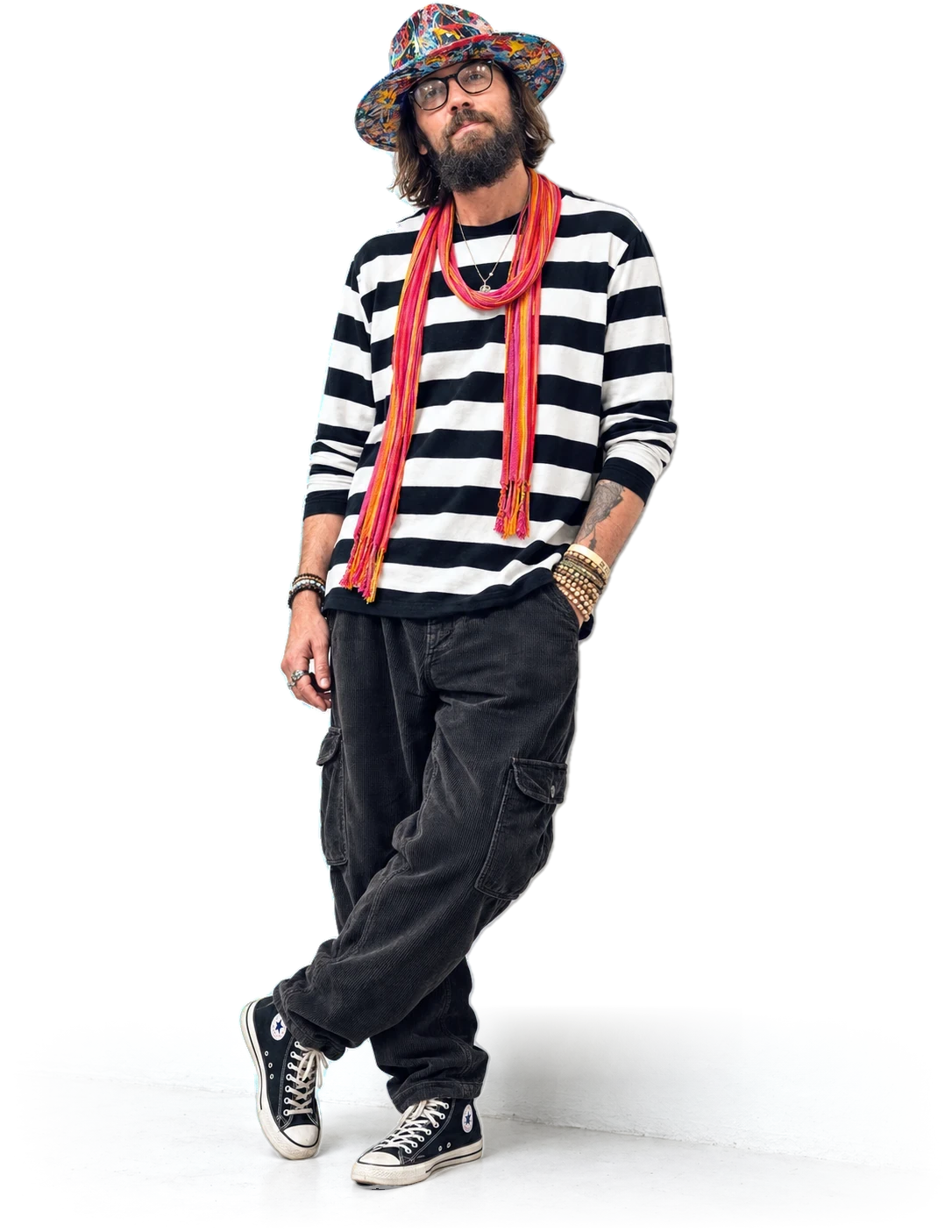 Sergey Gordienko standing in a striped shirt, painted hat and scarf